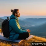 Home 20 명상적 여행의 다양한 효과 - A serene scene of a traveler meditating at sunrise on a quiet mountain peak in the Russian countrysi...